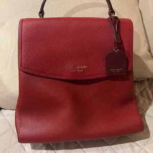 Kate Spade pebbled leather Thompson top handle red backpack